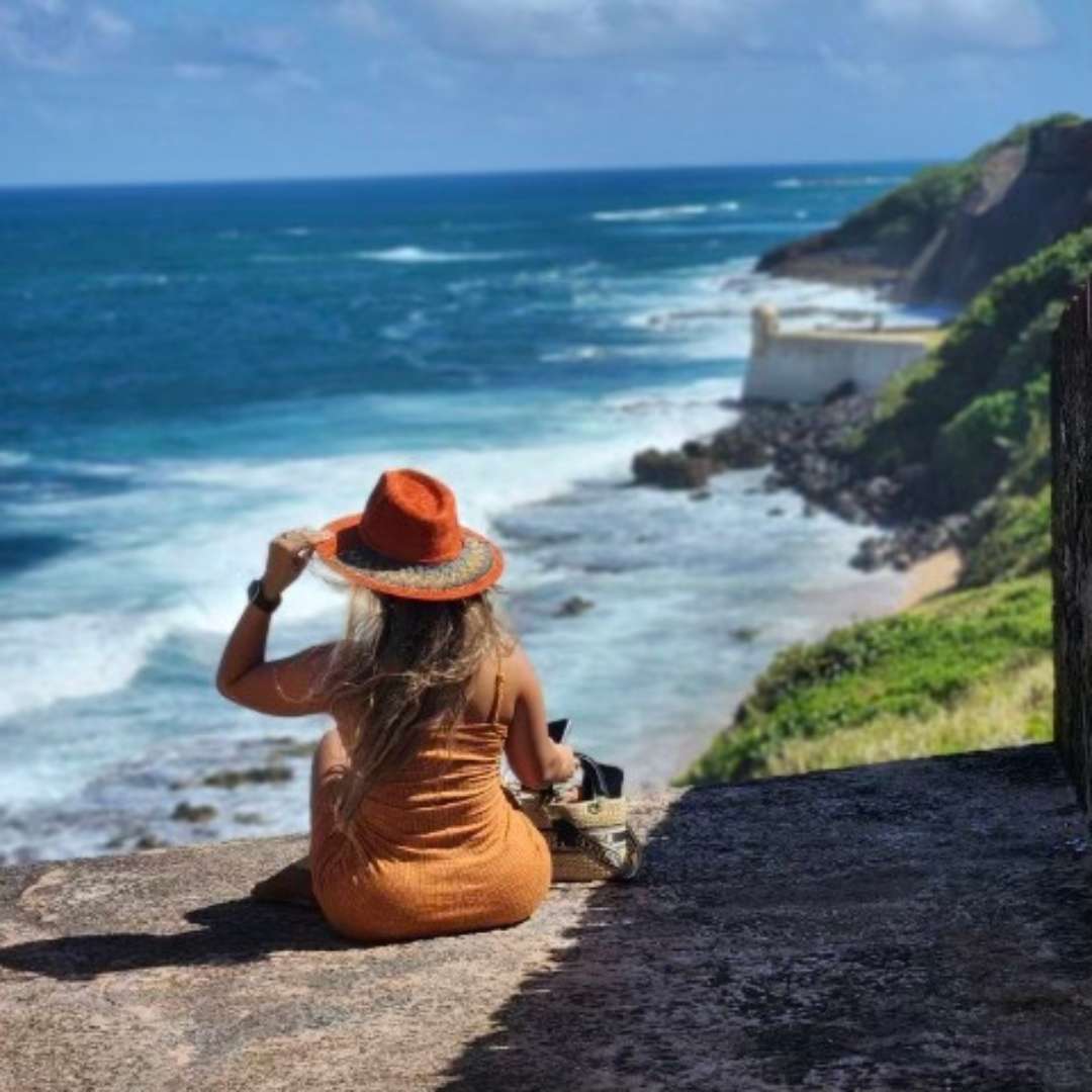 Woman wearing Matilda Gira hat with handmade hat accessory